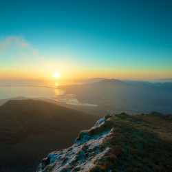 Sunset over mountain peak HD Wallpaper