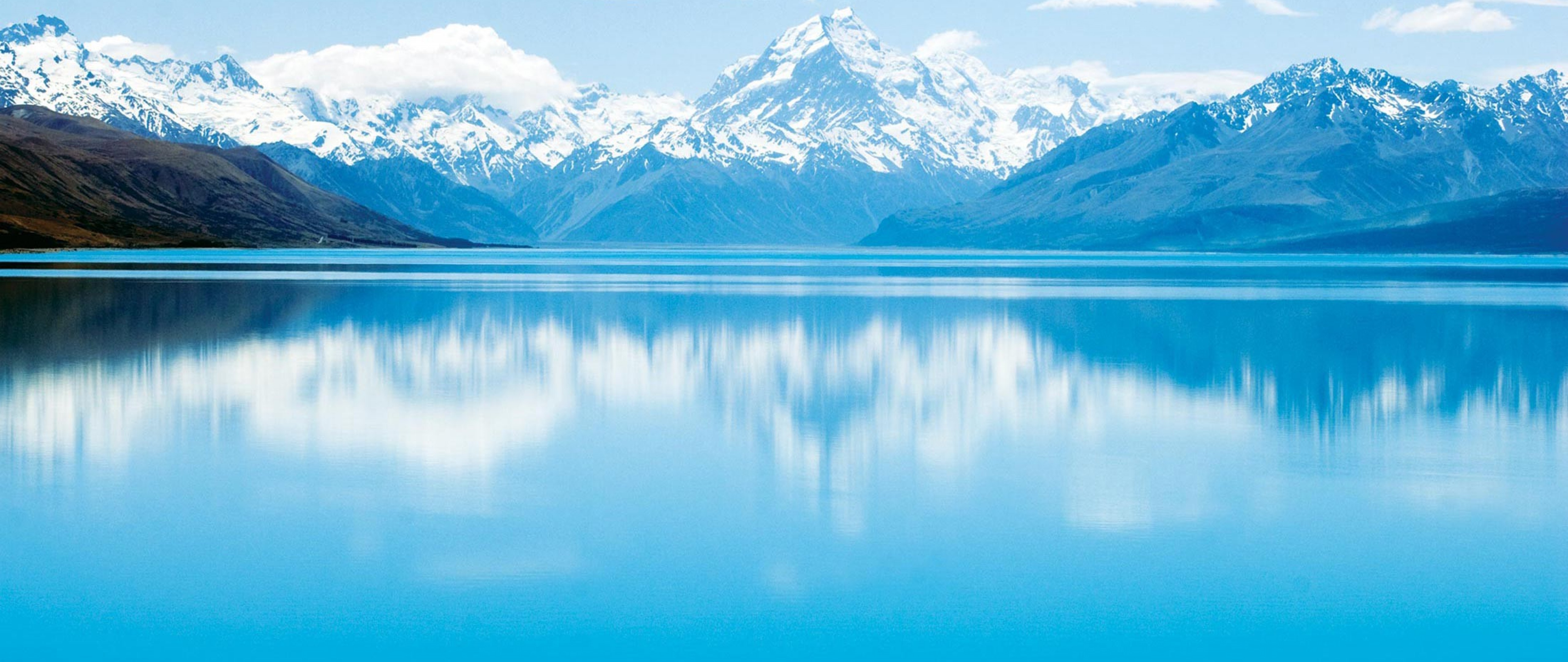 Горы и голубая вода. Море и горы. Горы отражение в воде. Фон горы вода. Чистая Горная вода.