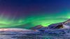 Aurora Borealis and Snowy Mountains