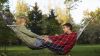 Boy and girl laying on a hammock HD Wallpaper