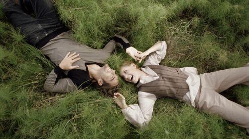 Couple laying at the grass HD Wallpaper