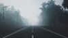 Driving on a foggy road HD Wallpaper