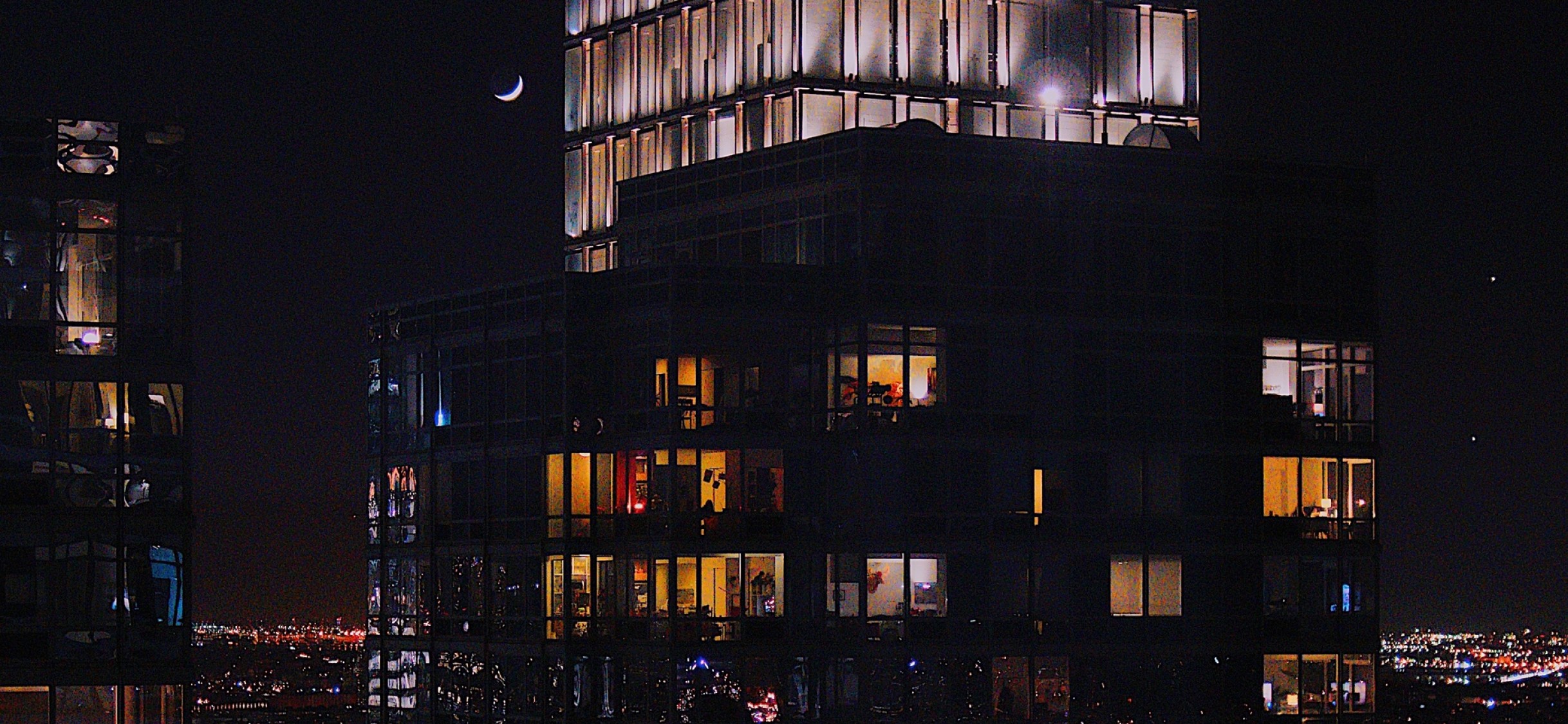 Lights inside building's windows HD Wallpaper