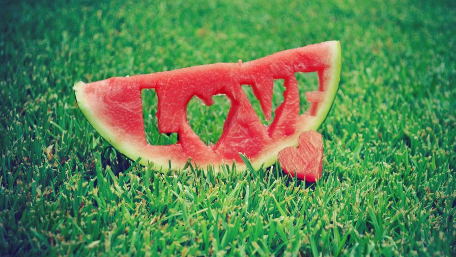 Love carved into a slice of watermelon HD Wallpaper