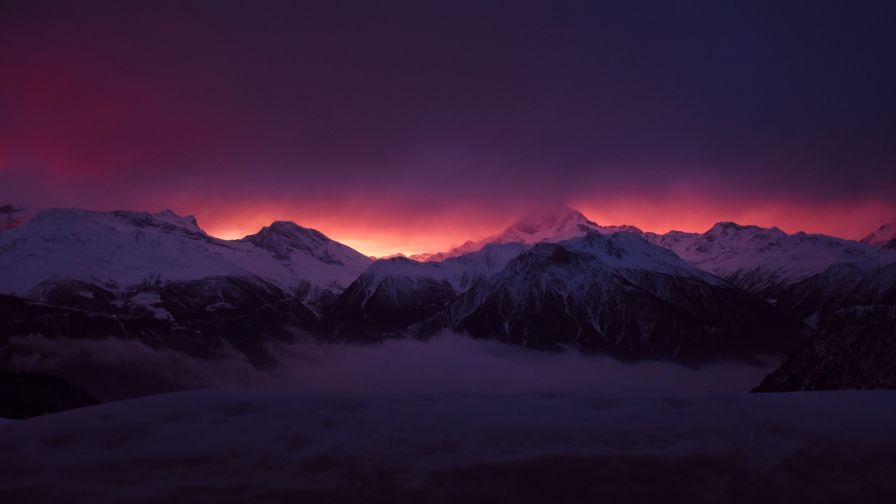 Mountains under a red sky HD Wallpaper
