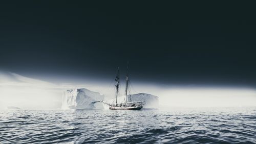 Ship sailing through an iceberg HD Wallpaper