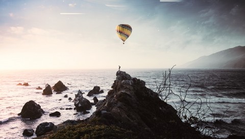 Silhouette under an air balloon HD Wallpaper