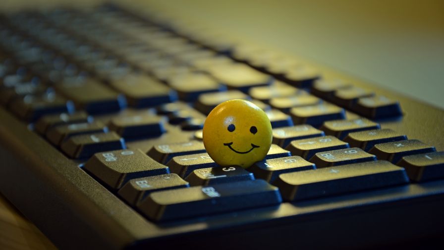 Smiley standing on a keyboard HD Wallpaper Wallpapers net