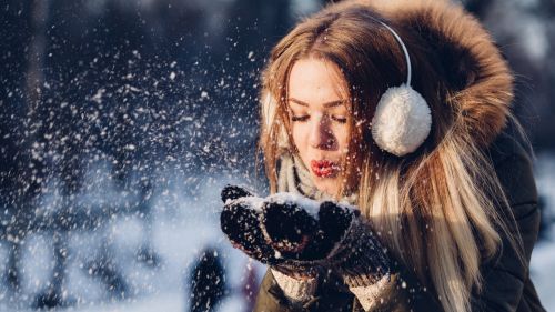 Woman Blowing Snow from Hand HD Wallpaper