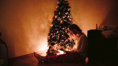Woman Sitting Near the Christmas Tree HD Wallpaper